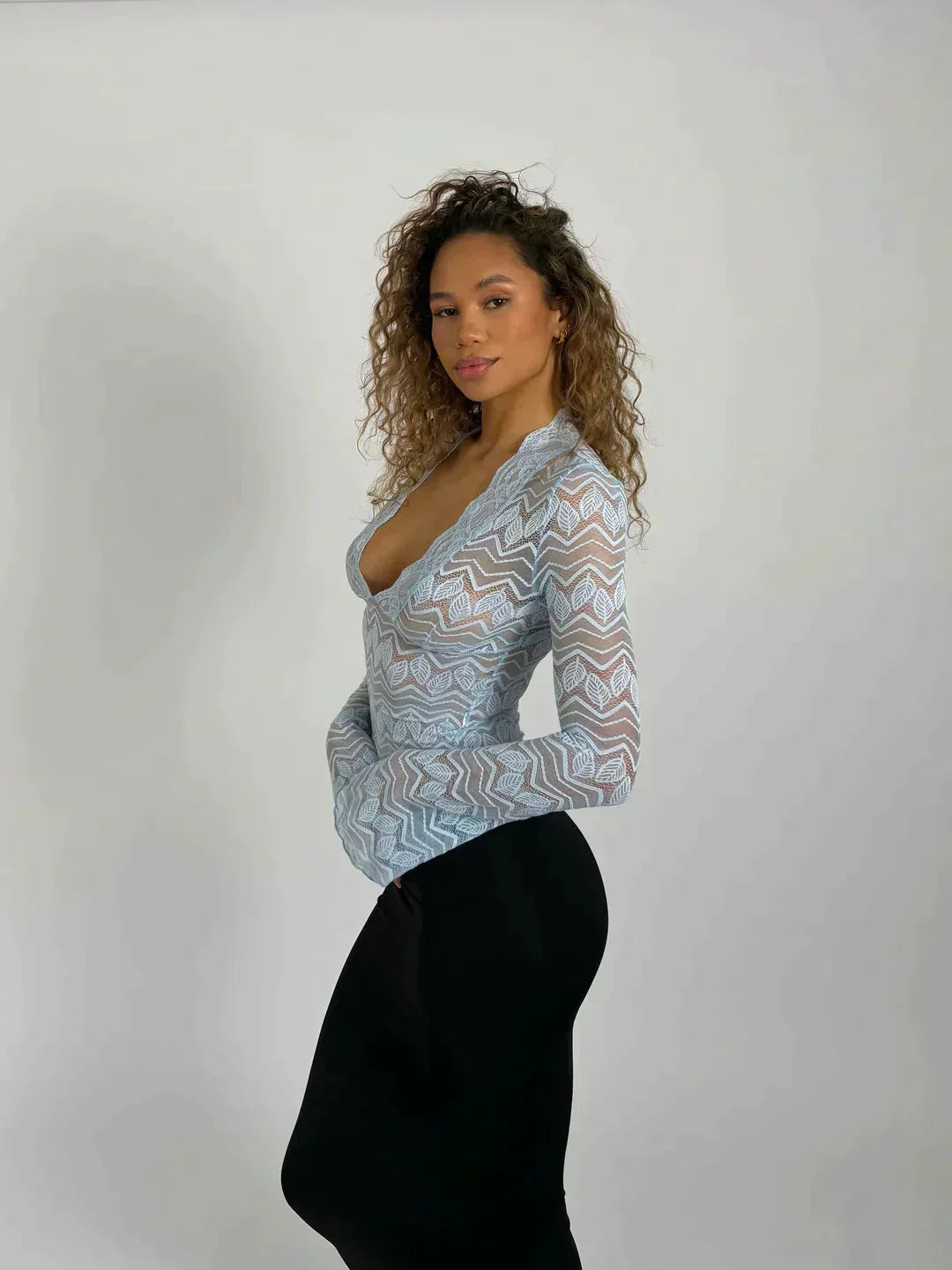 Haut court en dentelle florale à manches longues pour femme